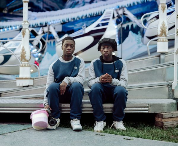 © Nina Schollaardt - Siblings Keith (14) and Atipa (15) at the Fun Fair Malieveld in The Hague, The Netherlands
