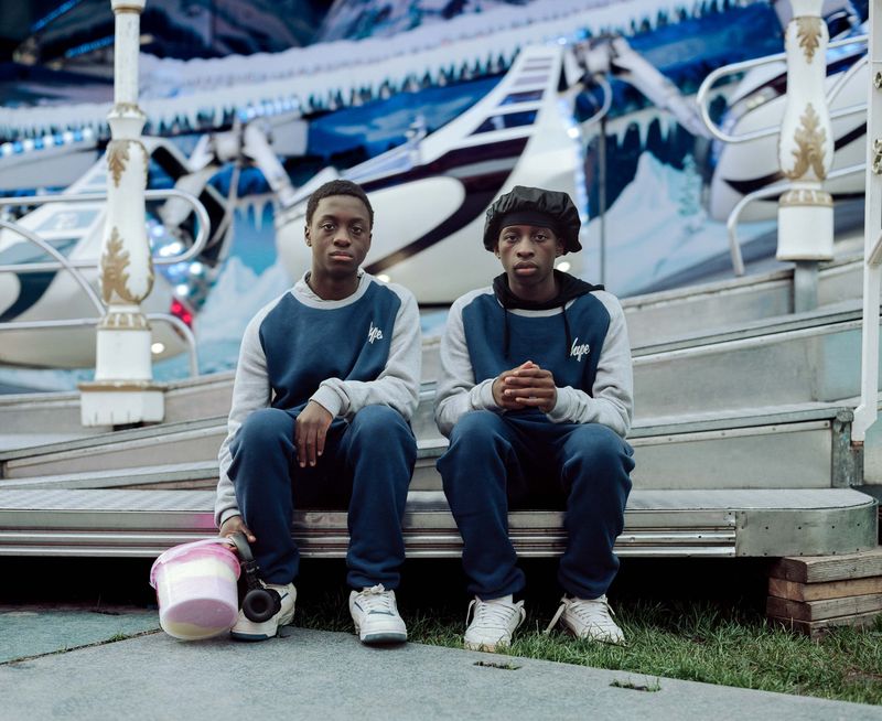 © Nina Schollaardt - Siblings Keith (14) and Atipa (15) at the Fun Fair Malieveld in The Hague, The Netherlands