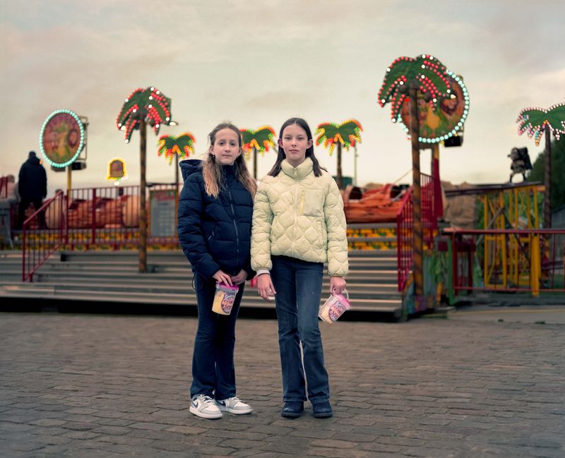 © Nina Schollaardt - Friends Eva (11) and Jacky (11) at the Fun Fair in Venlo, The Netherlands