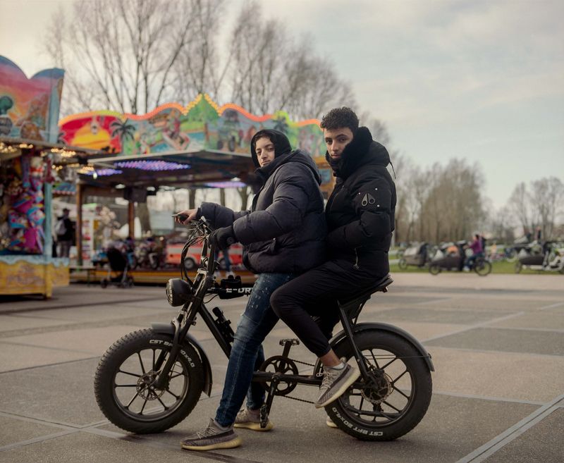 © Nina Schollaardt - Friends Yassir (15) and Ayoub (16) at the Fun Fair in Amsterdam, The Netherlands