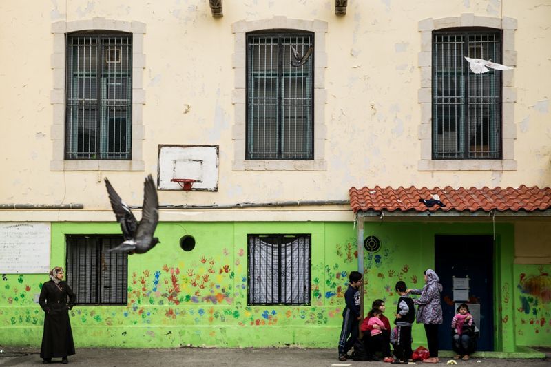 © Zoltán Balogh - Refugees are pictured near the entrance of a squat home named 5th School in Athens, Greece, 04 December 2016.