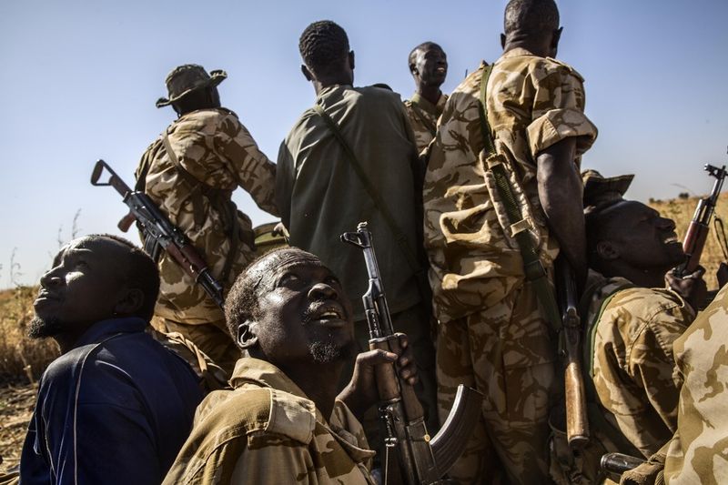 © Marco Gualazzini - Africa, Sudan, South Kordofan. The passage of an Antonov above the front line causes tension among the troops. 2nd dec 2013