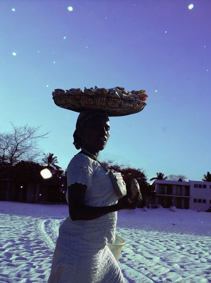 © yingying gao - August 2023, Dar es Salaam. A woman selling nuts by the seaside.