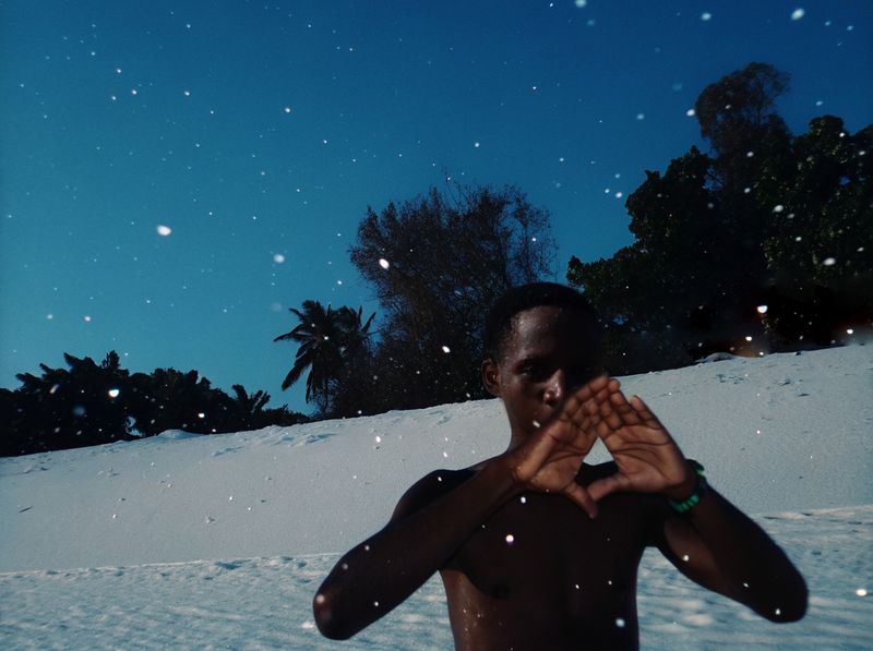 © yingying gao - August 2023, Dar es Salaam. A man emerging from the sea after a swim.
