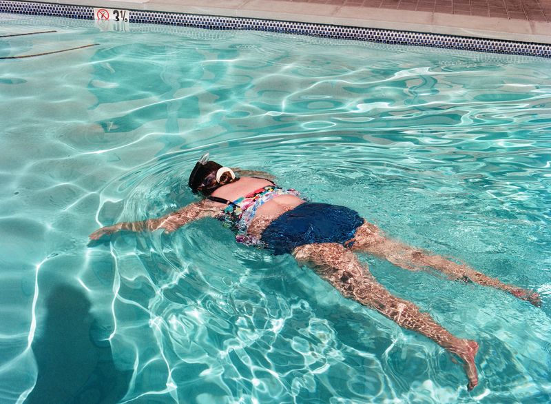 © Macey J. Foronda - Mom in Hotel Pool