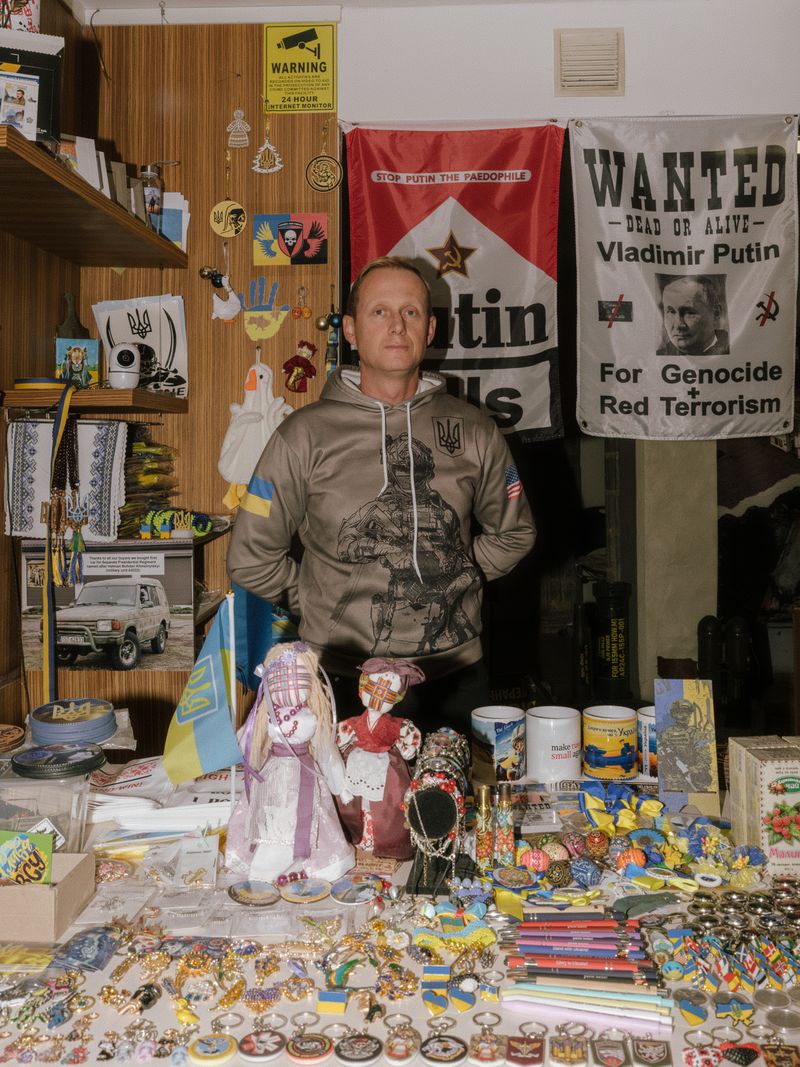 © Benedetta Di Ruggiero - Portrait of a shopkeeper in Tallinn, Estonia, selling Ukraine-themed items to support the country’s defense efforts.