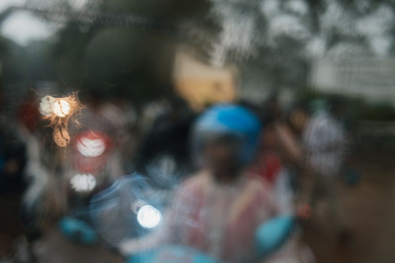 © Yvonne Chu - Rain-blur slows certainty; seeing lags behind understanding at the street’s threshold.
