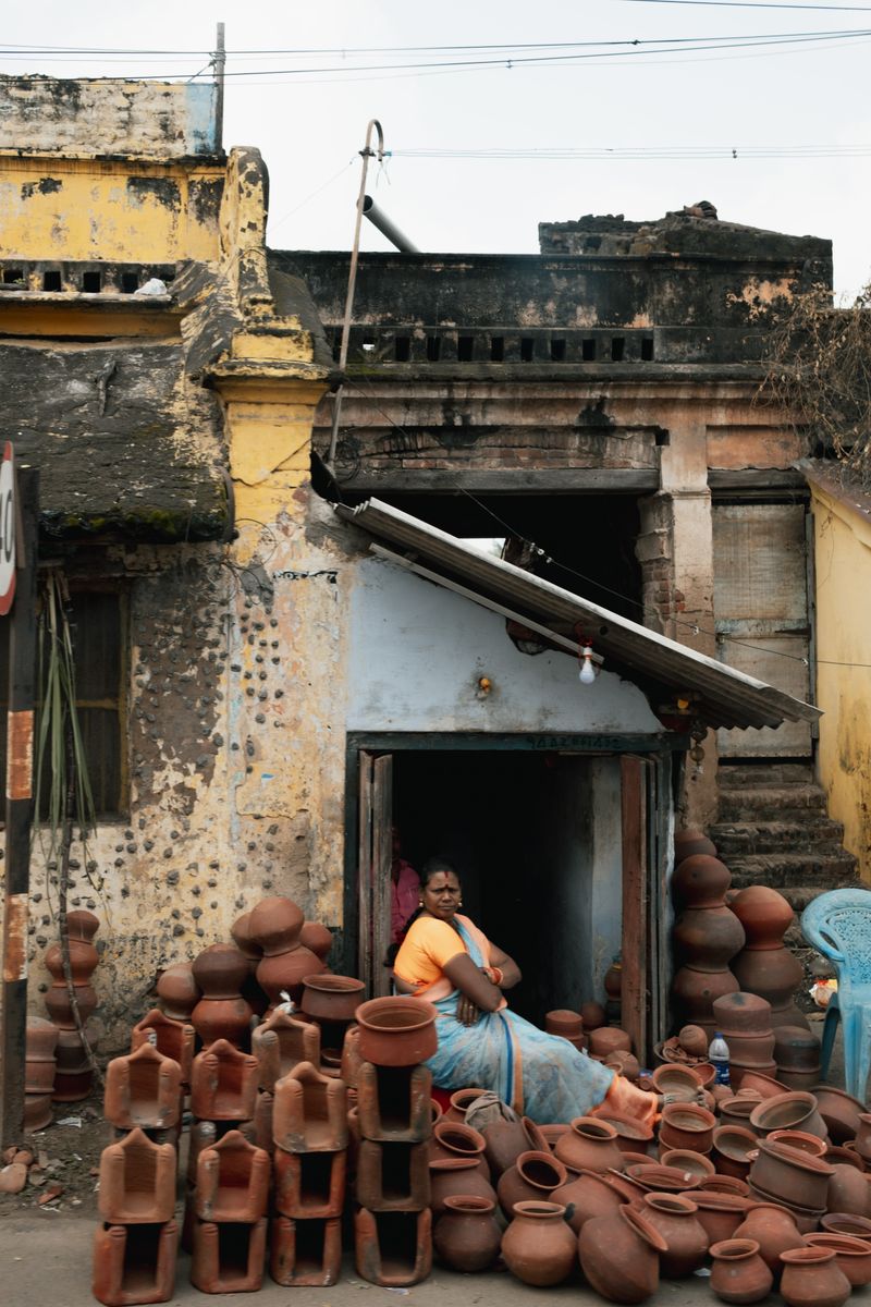 © Yvonne Chu - Clay vessels stacked at a doorway; containers for heat, water, and daily labor.