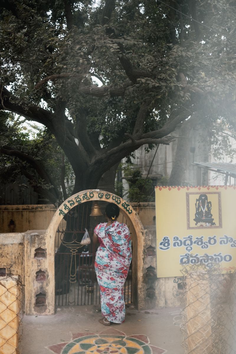 © Yvonne Chu - At a shrine gate, a pause at the threshold; devotion enters the day quietly.