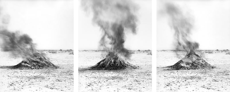 © Nicholas Albrecht - Mounds of burning soil approximately 15.1 miles from test site.