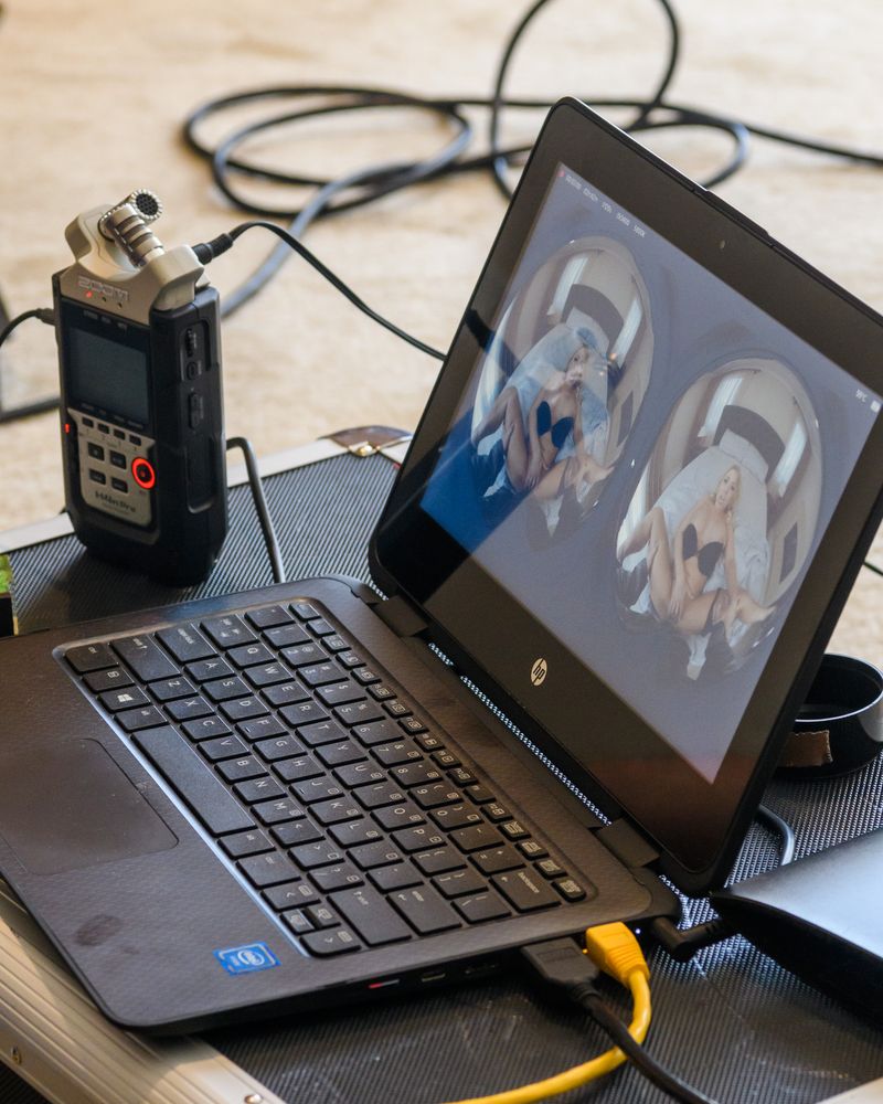 © Alastair Philip Wiper - 180 degree video from two cameras is previewed on a laptop on set.