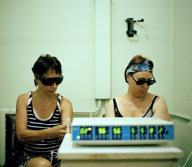 © Michal Solarski - Laser. Women getting laser treatment at Mishor sanatorium. August 2016, Crimea.