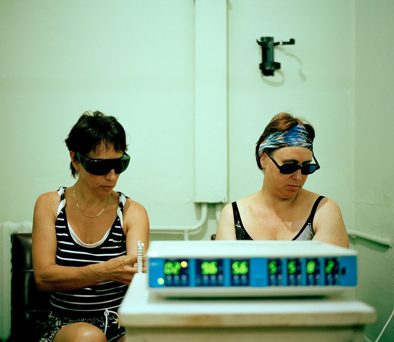 © Michal Solarski - Laser. Women getting laser treatment at Mishor sanatorium. August 2016, Crimea.