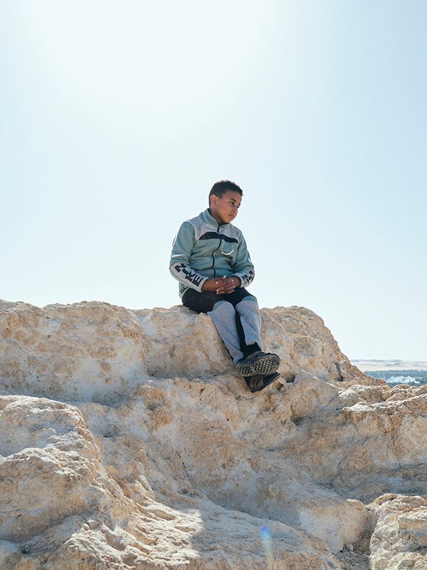© Nathalie Mohadjer - 10 years old Mohammad, Fatimas nephiew, on top of Siwa's Shali mountain