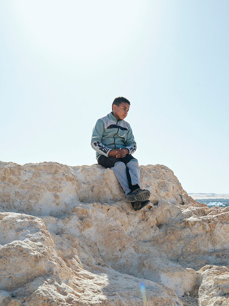 © Nathalie Mohadjer - 10 years old Mohammad, Fatimas nephiew, on top of Siwa's Shali mountain