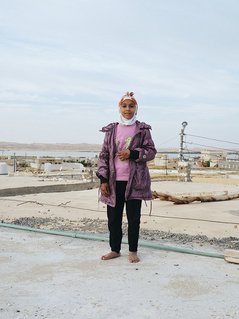 © Nathalie Mohadjer - Fatimas niece on her brothers rooftop.