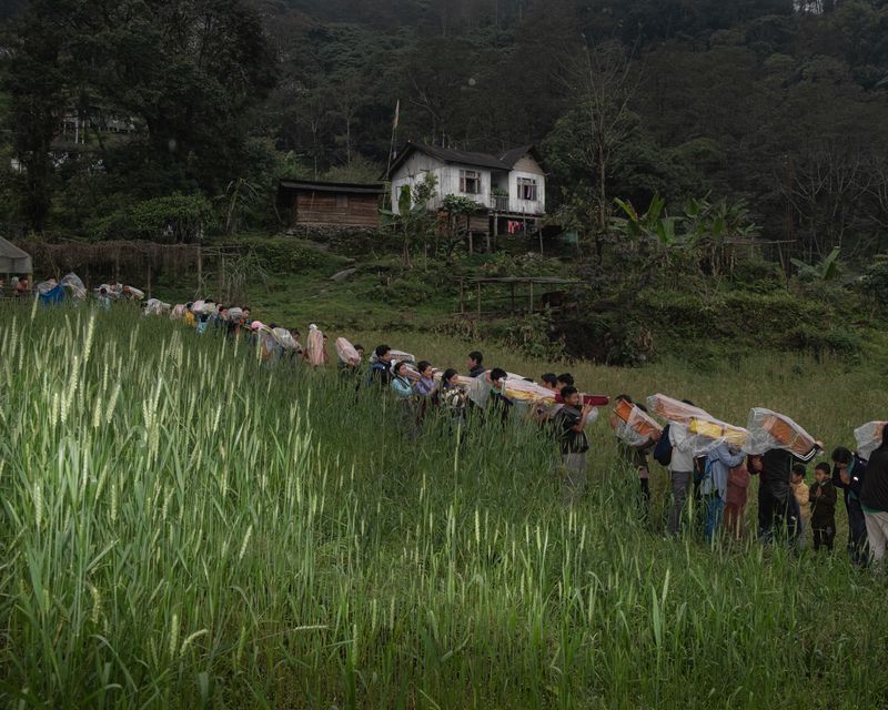 © Kunga Tashi Lepcha - People carrying sacred texts during a religious procession to the nearby villages in Dzongu, to bless the community. (2025.)