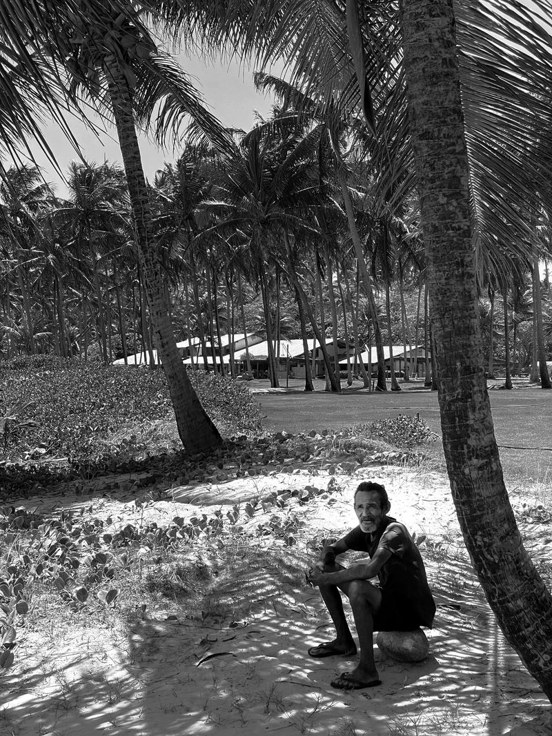 © Sergio Fadul - 19.	Persistent Presence — Alagoas, 2025(Local man before luxury house — Passo de Camaragibe)