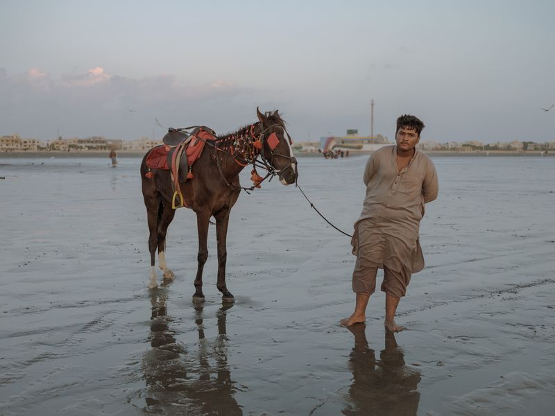 © Jo Ann Walters - vendor + horse, untitled from series The Arabian Sea:Until Their Bodies Glowed, 2023