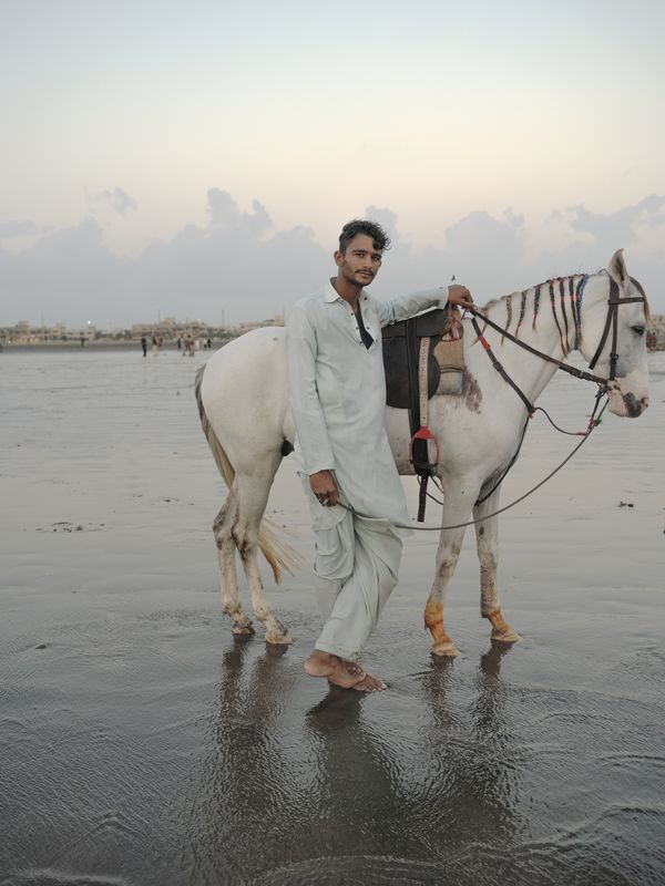 © Jo Ann Walters - vendor + horse, untitled from series The Arabian Sea:Until Their Bodies Glowed, 2023
