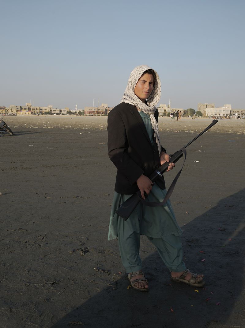 © Jo Ann Walters - vendor w air gun, untitled from series The Arabian Sea:Until Their Bodies Glowed, 2023