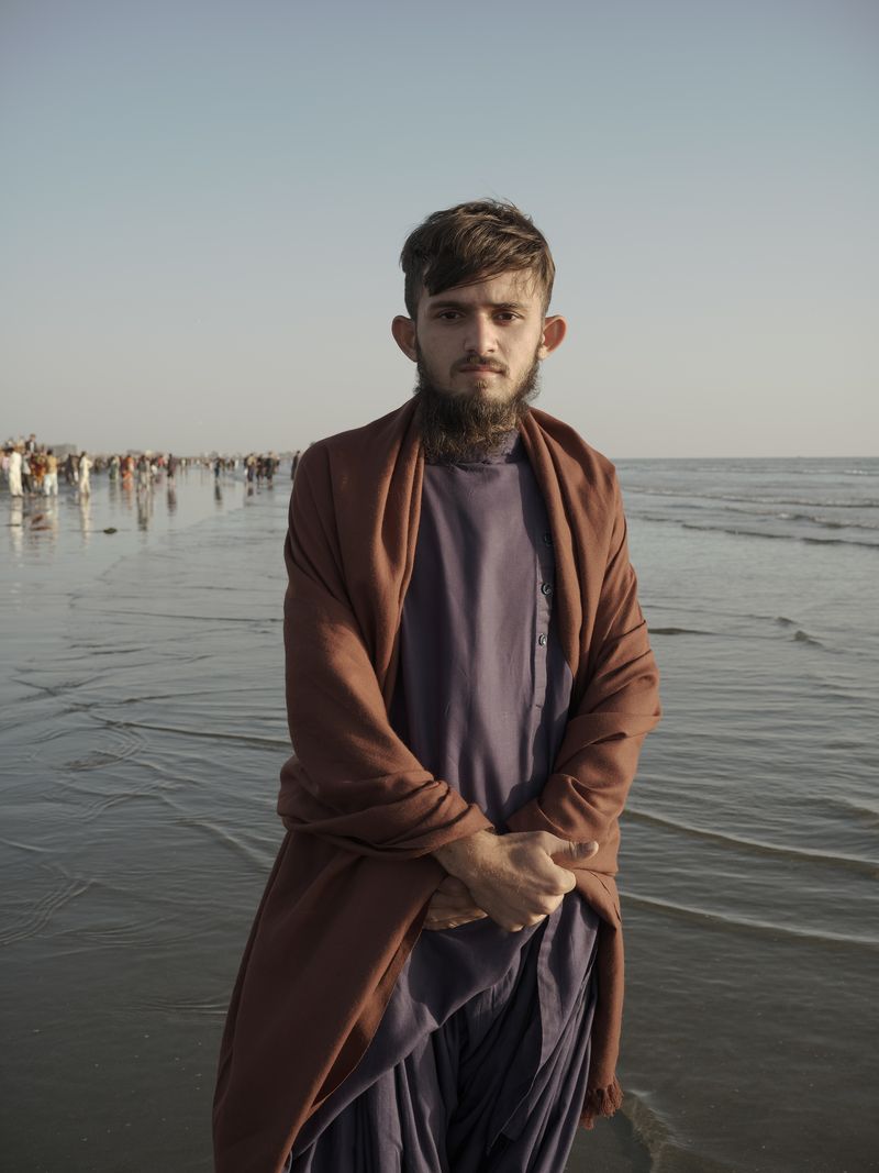 © Jo Ann Walters - man in purple + brown garments, untitled from series The Arabian Sea:Until Their Bodies Glowed, 2023