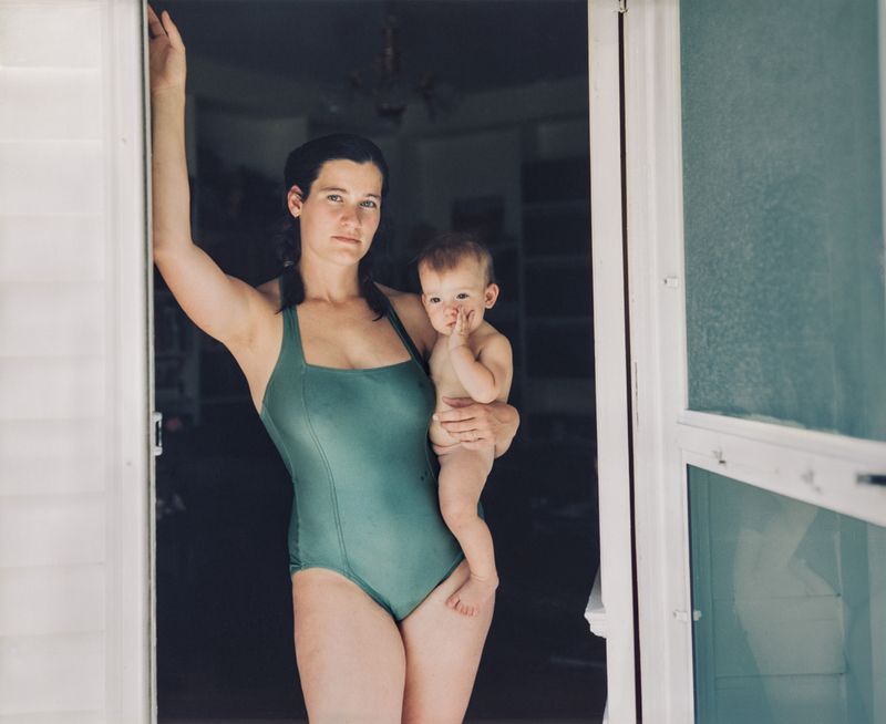 © Jo Ann Walters - 17_mother in green swimsuit w baby in doorway, from the series Vanity + Consolation, 1988-present