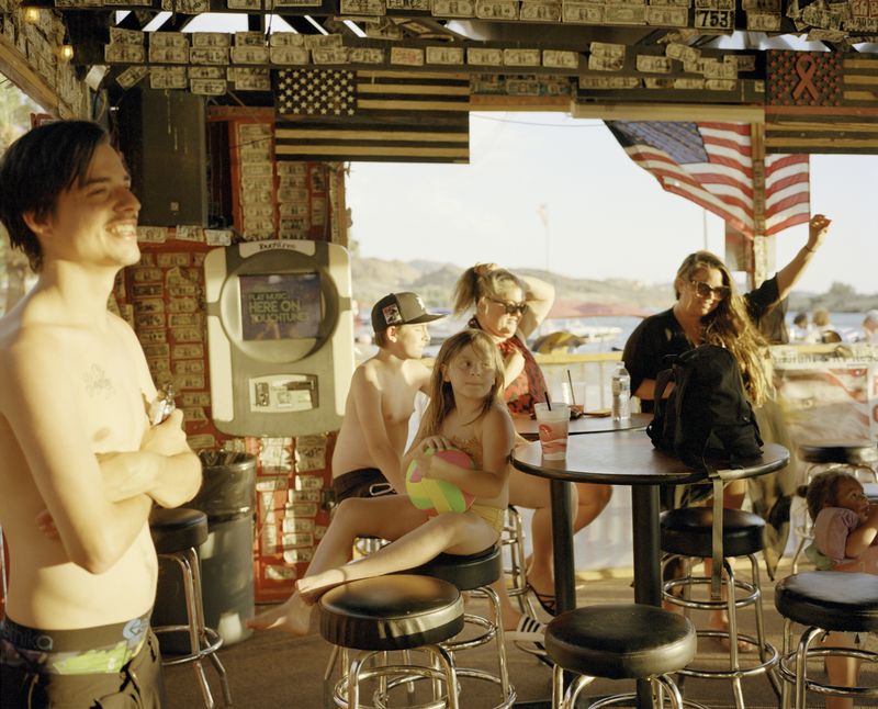 © Scott Rossi - The Snook family during their summer vacation at a floating bar up the Colorado River. Imperial County, CA. 2022.
