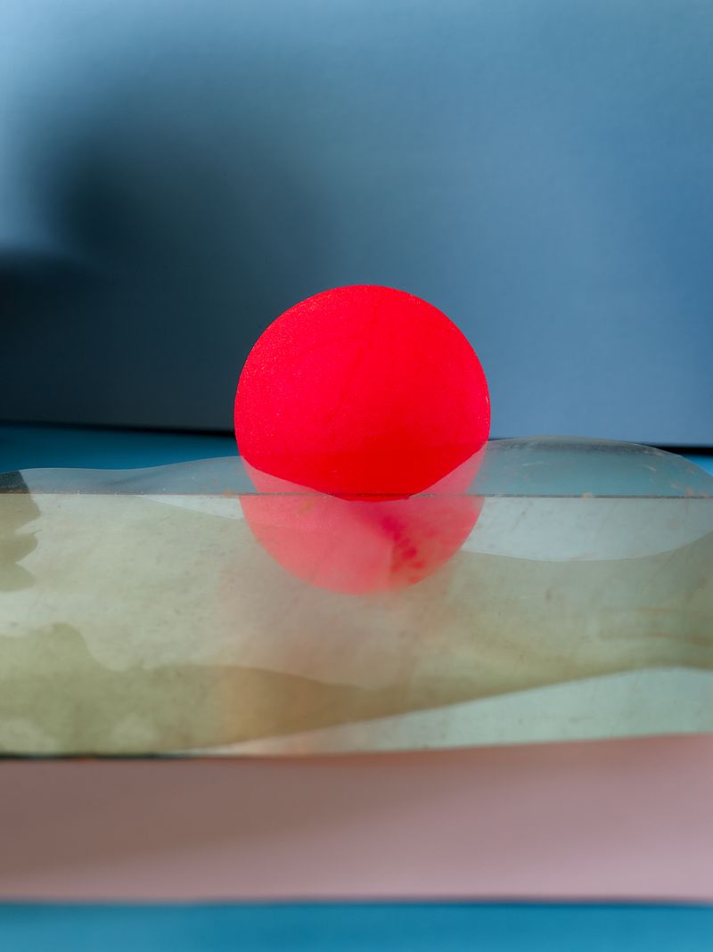 A red ball on piece of plastic
