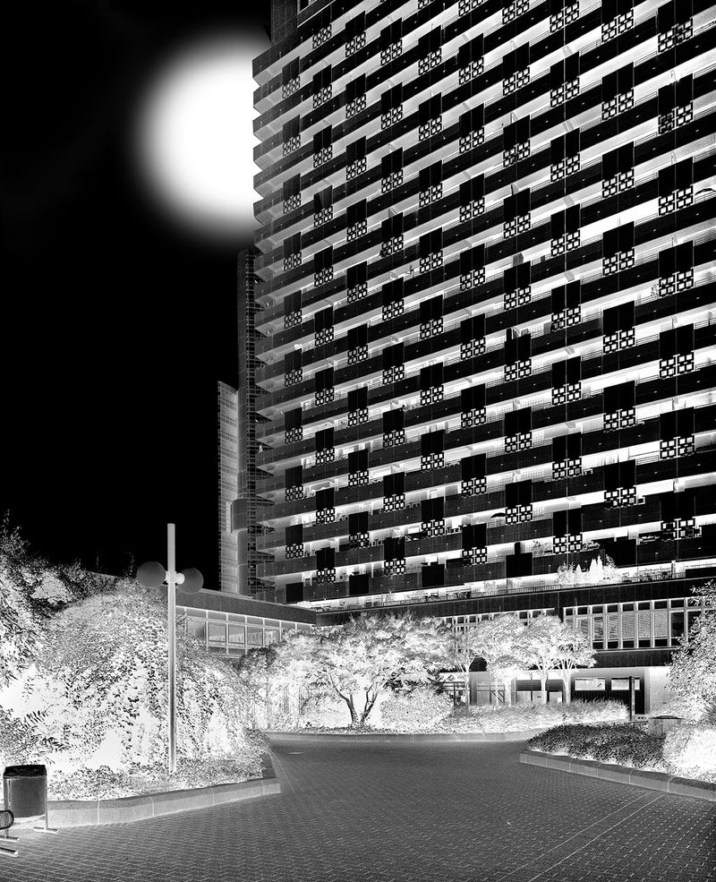 © Jens Masmann - "The moon can be seen peeking out from behind one of these buildings."