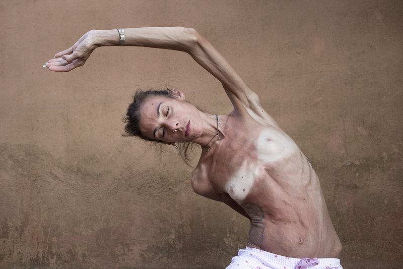 © Leonardo Chiarabini - Vanessa does her yoga workout. Elba Island, Italy.