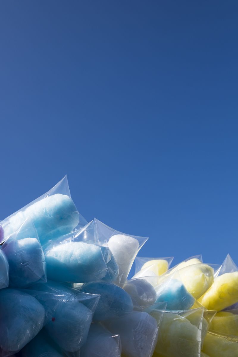 © Cris Veit - Clouds of cotton candy wrapped in plastic bags are set up against the beautiful blue sky of lake Atitlán