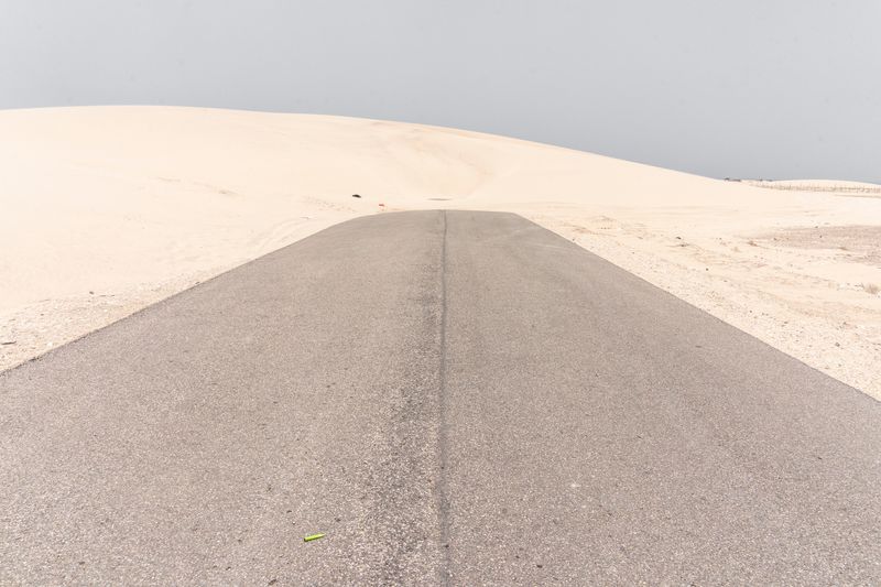 © Jorge Gutierrez Lucena - Road connection between the main highway and a fishing village obstructed by sand accumulation.