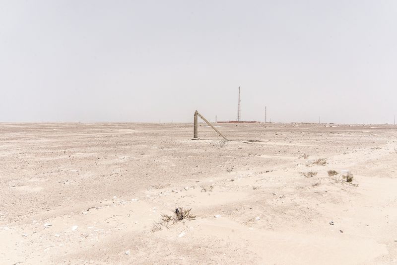 © Jorge Gutierrez Lucena - A damaged electricity pole in the foreground. In the distance, a coastal security post with communication towers.