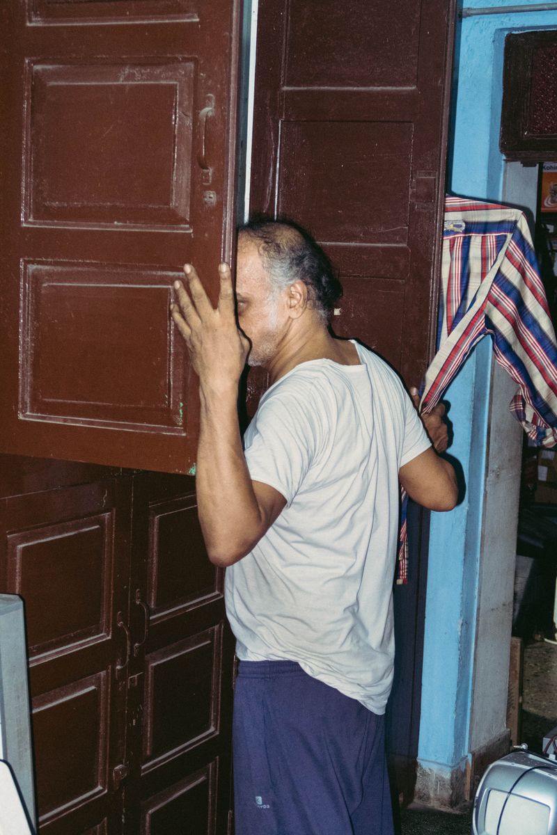 © Balaji Maheshwar - My father Maheshwar looking inside his cupboard