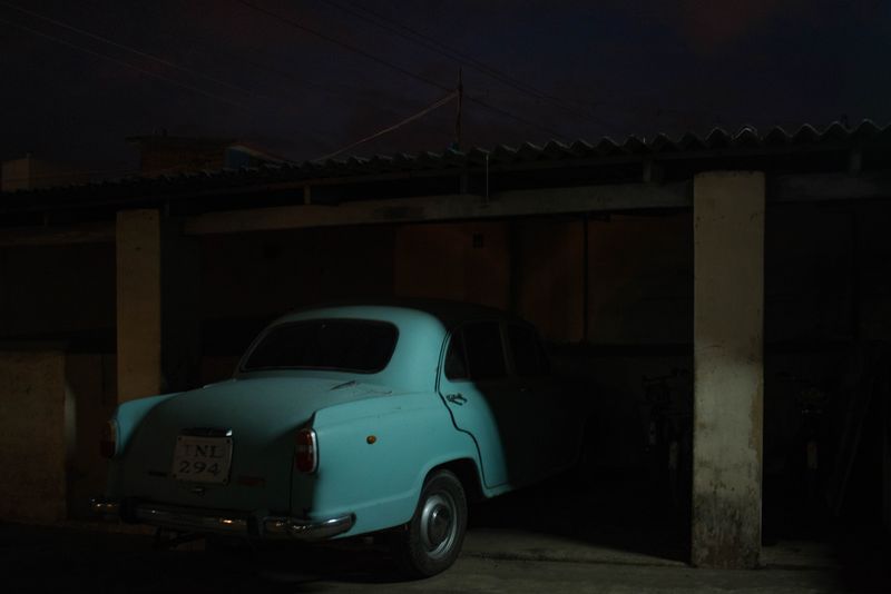 © Balaji Maheshwar - A car parked inside a cinema hall that was shut down
