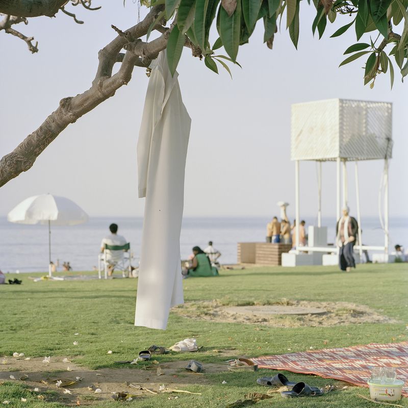 © Josh Adam Jones - Dishdasha on Shatti Beach. Muscat, Oman.