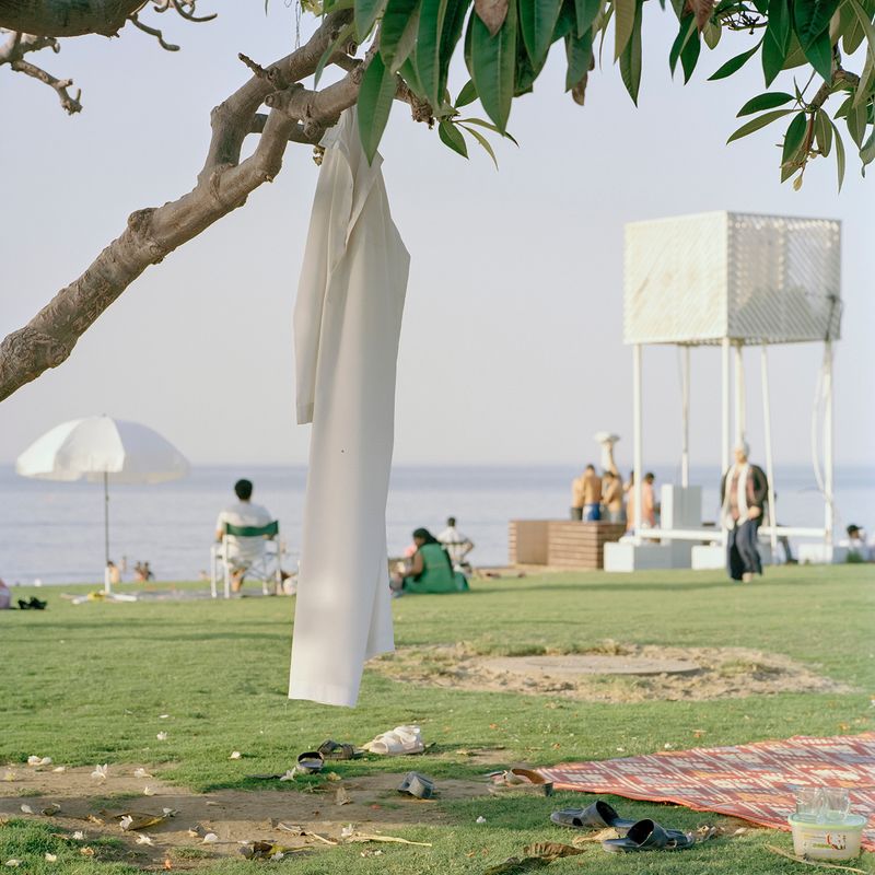 © Josh Adam Jones - Dishdasha on Shatti Beach. Muscat, Oman.