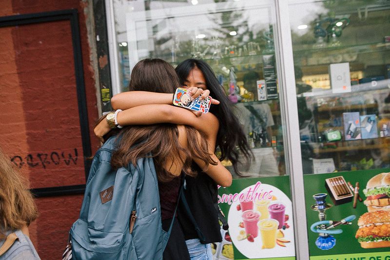 © Cassandra Giraldo - Two friends greet each other on the first day of school in Brooklyn on September 9, 2015.