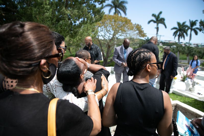 © Jayde Gibbons - Family and friends at the burial of Charles Thomas.