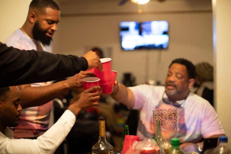 © Jayde Gibbons - Small gathering of loved ones sharing food and lobations after the homegoing service of Jan Martin.