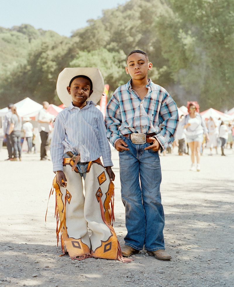 © Gabriela Hasbun - Two junior rodeo champions at the 2018 BPIR, Harold Williams Jr. (in chaps) and Lindon Demery.