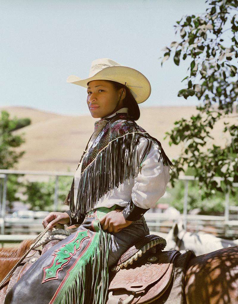 © Gabriela Hasbun - Cowgirl Denesha Henderson prepares for the BPIR Grand Entry in Oakland, California. 2008