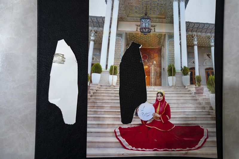 © Ali Rad - Hanieh has torn up her ex-husband's photos as a reminder of his strictness.
