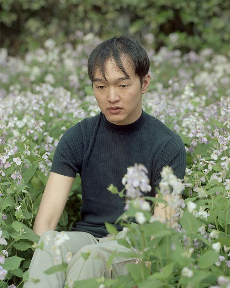 © Bowei Yang - Pan sitting in the flower lawn, Beijing, China, 2017.