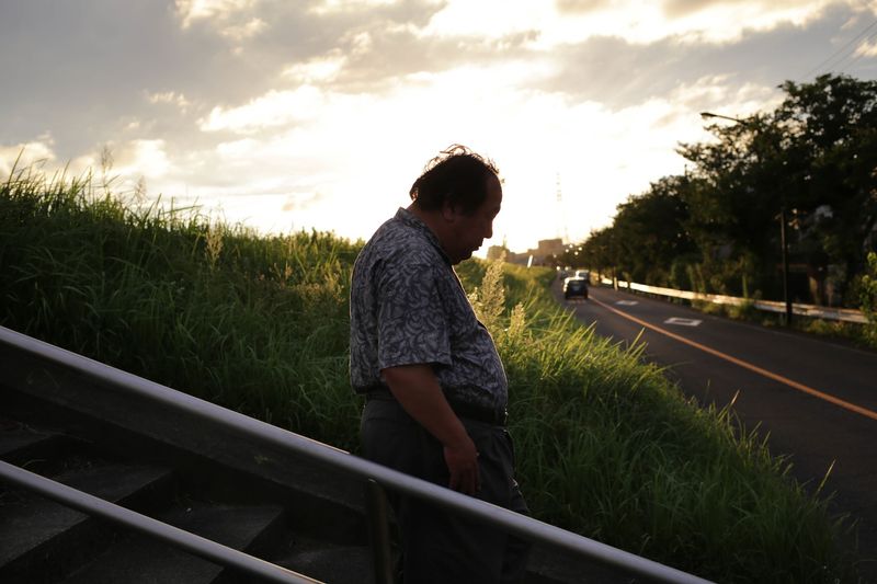 © Taro Karibe - Senji Nakajima gets back to his car to bring his Love Doll 'Saori' to a Fireworks event on August 21, 2016 in Tokyo, Japan.