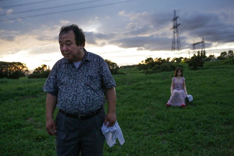 © Taro Karibe - Senji Nakajima goes out with his Love Doll 'Saori' to a fireworks event on August 21, 2016 in Tokyo, Japan.