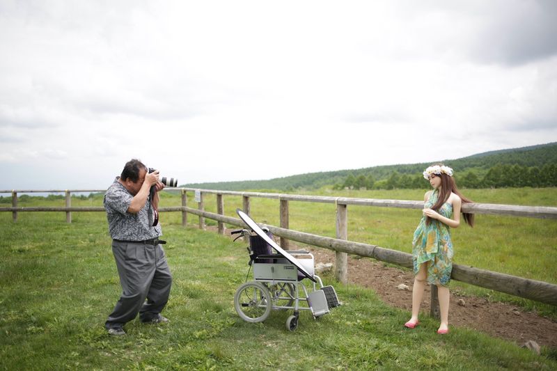 © Taro Karibe - Senji Nakajima takes portrait of his Love Doll 'Saori' at a stock farm on June 5, 2016 in Nagano, Japan.
