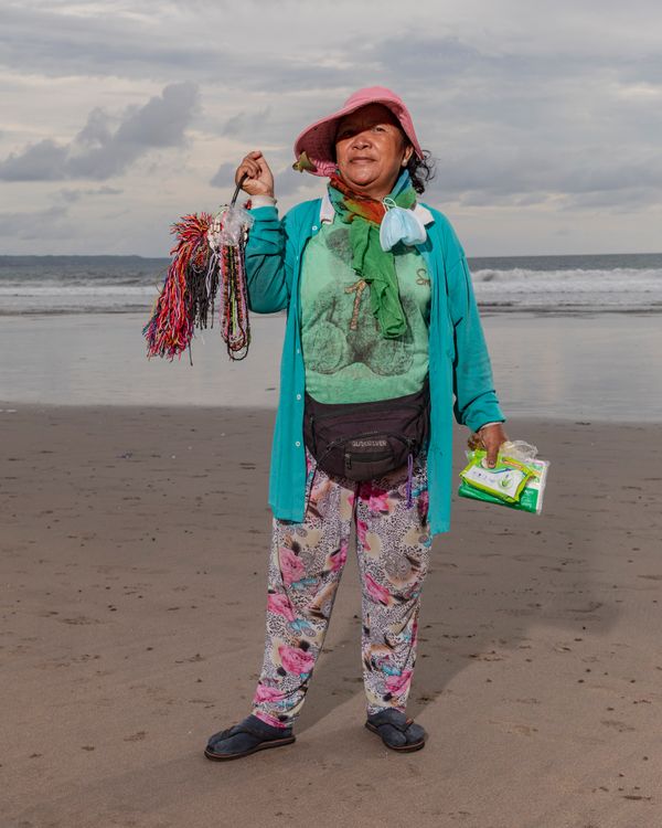 © Nyimas Laula - Ketut Listrik, 58, has been selling souvenirs like bracelets and necklaces for thirty years at DoubleSix Beach, in Bali.