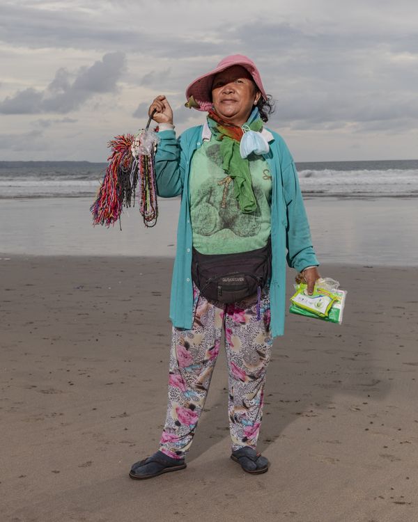 © Nyimas Laula - Ketut Listrik, 58, has been selling souvenirs like bracelets and necklaces for thirty years at DoubleSix Beach, in Bali.